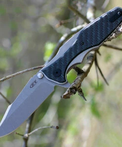Zero Tolerance 0393GLCF, 3.5" CPM 20CV Plain Blade, Titanium/Glow in the Dark Carbon Fiber Handle