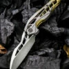 We Knife Co. We Knife Arrakis Framelock Folder 906C, 3.45” Bohler M390 Satin Wharncliffe Plain Blade, Gold and Gray Titanium Handle