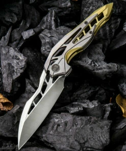 We Knife Co. We Knife Arrakis Framelock Folder 906C, 3.45” Bohler M390 Satin Wharncliffe Plain Blade, Gold and Gray Titanium Handle