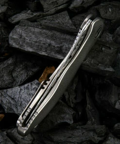 We Knife Co. We Knife Synergy 2 Framelock Folder 912DS1, 3.49" Heimskringla Damasteel Trailing Point Plain Blade, 6AL4V Titanium Satin Polished Grooved Handle -Buck Knives Sales 1575254001459506 79582.1582054593