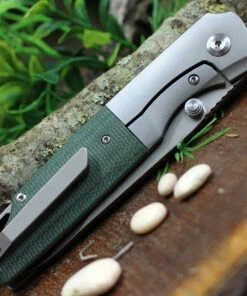 Kansept Knives, K1005T7, Warrior Flipper Knife, 3.4" CPM-S35VN Drop Point Blade, Titanium with Green Micarta Handle -Buck Knives Sales K1005T7.2 66687.1617391382