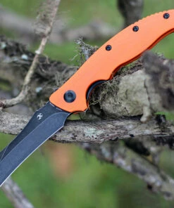 Kansept Knives T1017A2 Copperhead Flipper Knife, 3.4" 154CM Hawkbill Black Plain Blade, Orange G-10 Handle